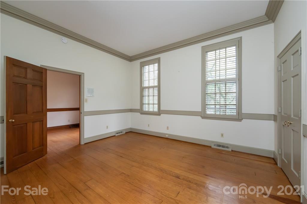 3229 Colony Road Charlotte, NC 28211 - Photo 13 of 44 an empty room with wooden floor and windows