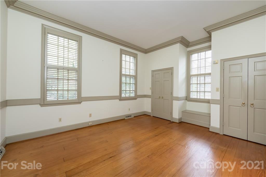3229 Colony Road Charlotte, NC 28211 - Photo 14 of 44 an empty room with wooden floor and windows