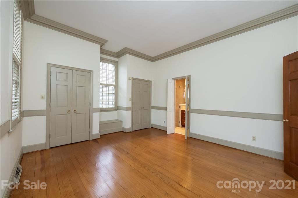 3229 Colony Road Charlotte, NC 28211 - Photo 15 of 44 an empty room with wooden floor and windows