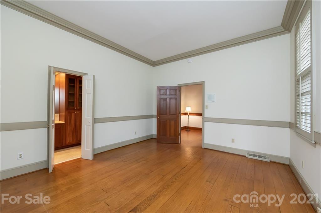 3229 Colony Road Charlotte, NC 28211 - Photo 16 of 44 an empty room with wooden floor and windows
