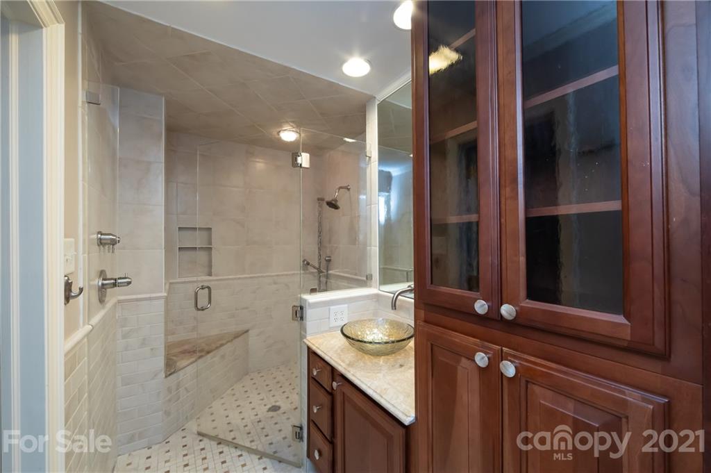 3229 Colony Road Charlotte, NC 28211 - Photo 17 of 44 a bathroom with a double vanity sink toilet and shower