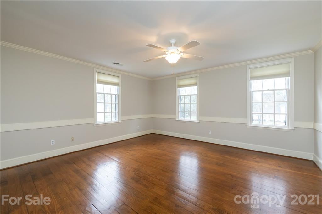 3229 Colony Road Charlotte, NC 28211 - Photo 22 of 44 an empty room with wooden floor and windows