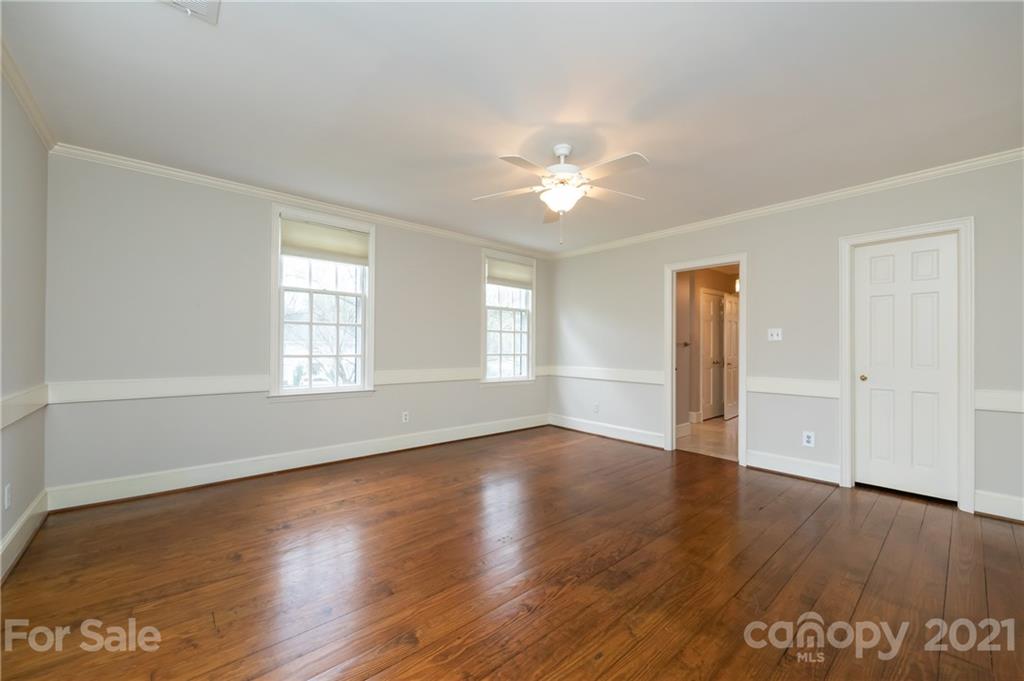 3229 Colony Road Charlotte, NC 28211 - Photo 23 of 44 an empty room with wooden floor and window