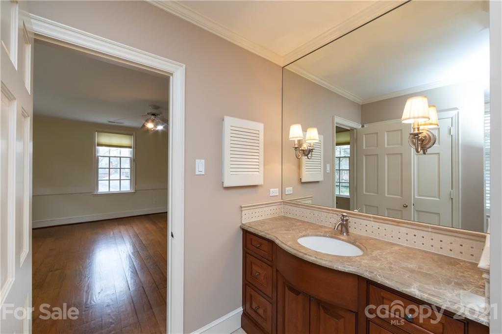 3229 Colony Road Charlotte, NC 28211 - Photo 26 of 44 a bathroom with a sink and a mirror
