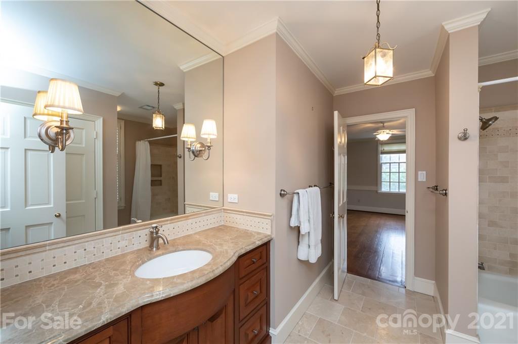 3229 Colony Road Charlotte, NC 28211 - Photo 27 of 44 a bathroom with a sink and a mirror