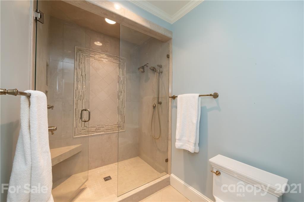 3229 Colony Road Charlotte, NC 28211 - Photo 32 of 44 a bathroom with a shower and a toilet