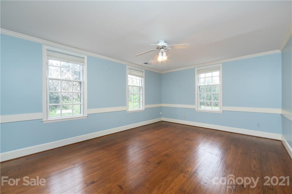 3229 Colony Road Charlotte, NC 28211 - Photo 33 of 44 an empty room with wooden floor and windows