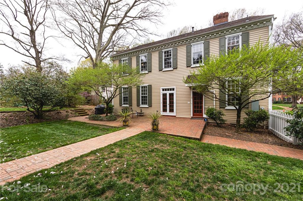 3229 Colony Road Charlotte, NC 28211 - Photo 40 of 44 a front view of a house with a yard and trees