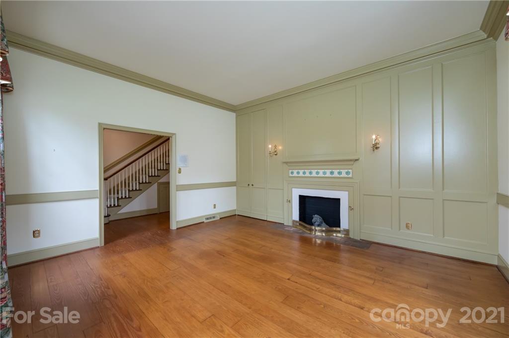 3229 Colony Road Charlotte, NC 28211 - Photo 5 of 44 a view of an empty room with a fireplace and a window