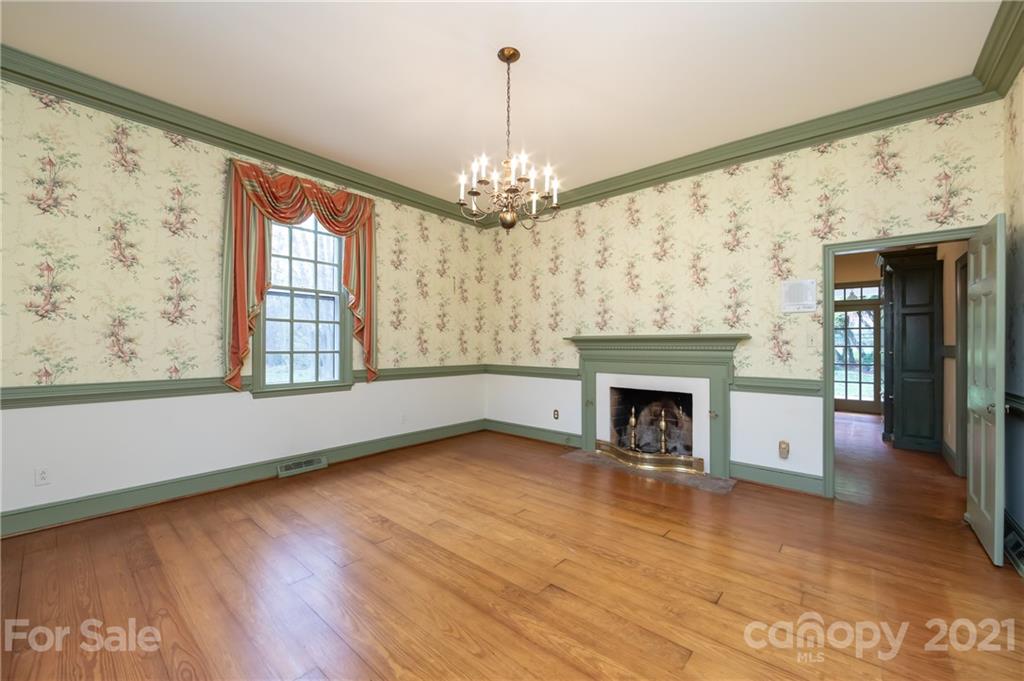 3229 Colony Road Charlotte, NC 28211 - Photo 7 of 44 a view of an empty room with a window and fireplace