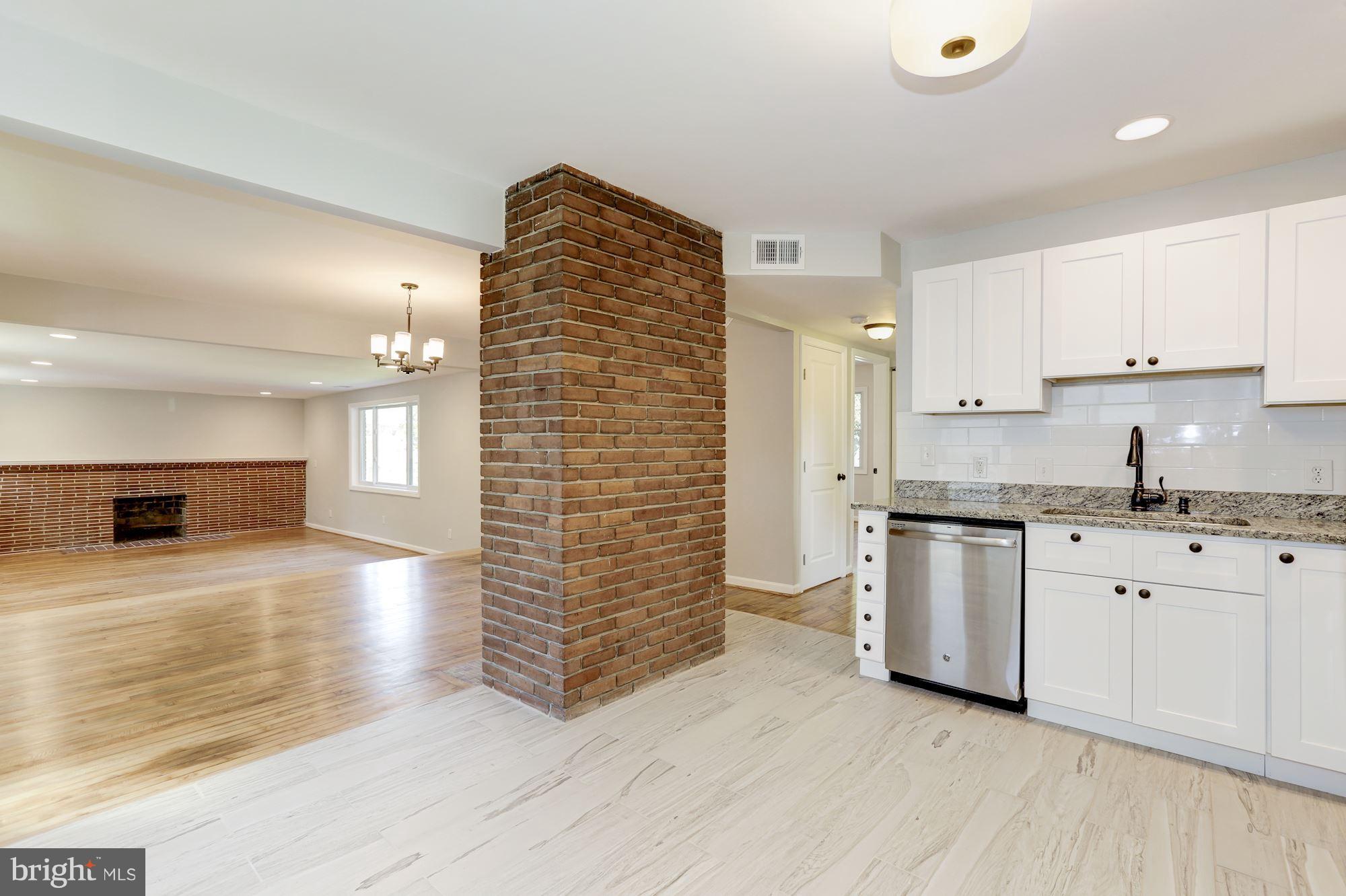 2105 Lanier Drive Silver Spring, MD 20910 - Photo 25 of 30 Kitchen open to fireplace and dining room