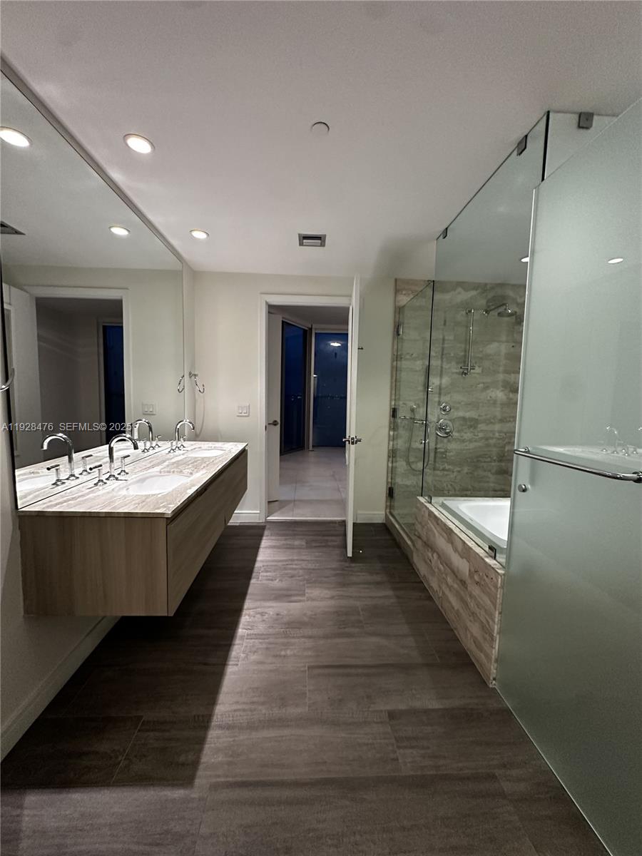 2900 Northeast 7th Avenue, Unit 1604 Miami, FL 33137 - Photo 4 of 10 a large spacious bathroom with double vanity and a bathtub