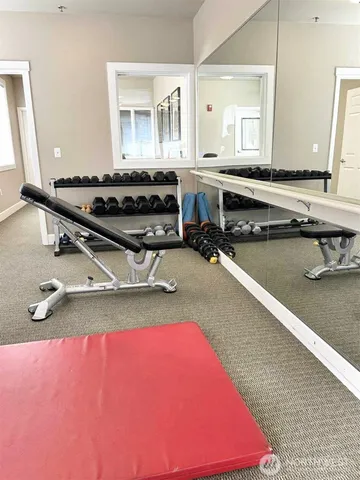 a living room with furniture a rug and a window