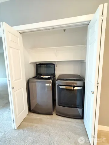 a kitchen with a stove and a refrigerator