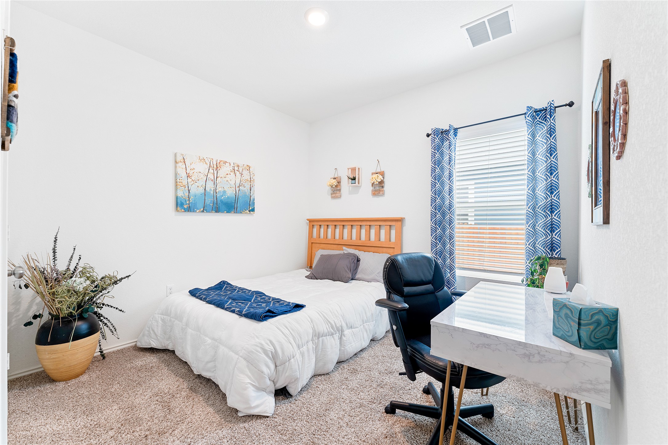 6009 Jagger Avenue Austin, TX 78747 - Photo 18 of 24 a bedroom with furniture and a bed