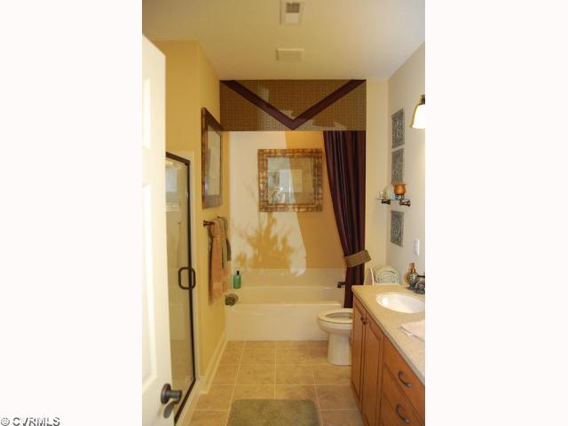 12142 Blossom Point Road, Unit 28C Chester, VA 23831 - Photo 8 of 12 Master Bath - Luxurious Master Bathroom with Double Sinks, Tub + Separate Stand-Up Shower