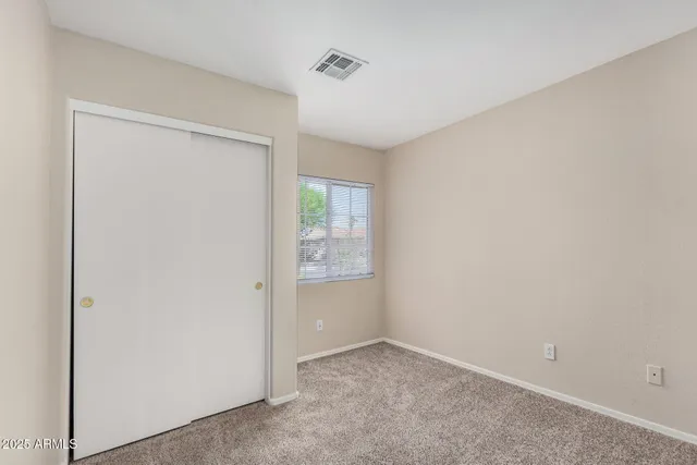 an empty room with a bathroom