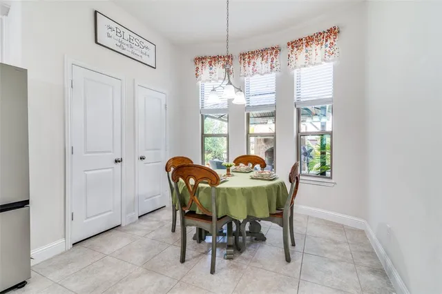a view of a dining room with furniture and a window