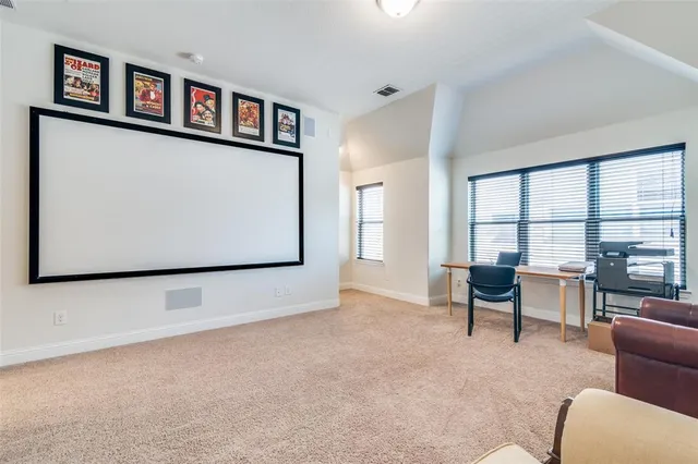 a view of work space with furniture and window