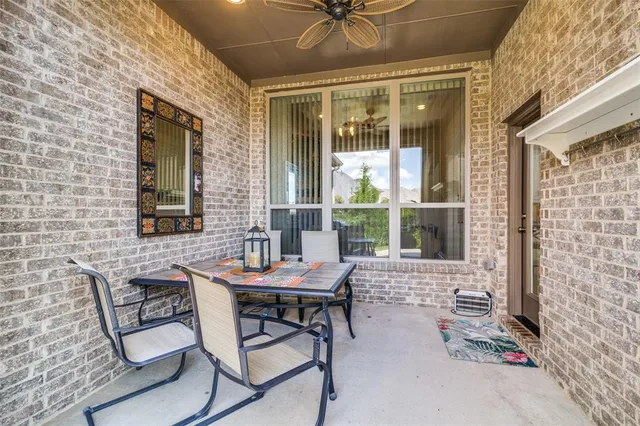 a backyard of a house with table and chairs