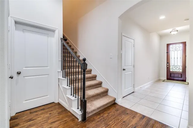 a view of a hallway with entryway wooden floor and hall with wooden floor