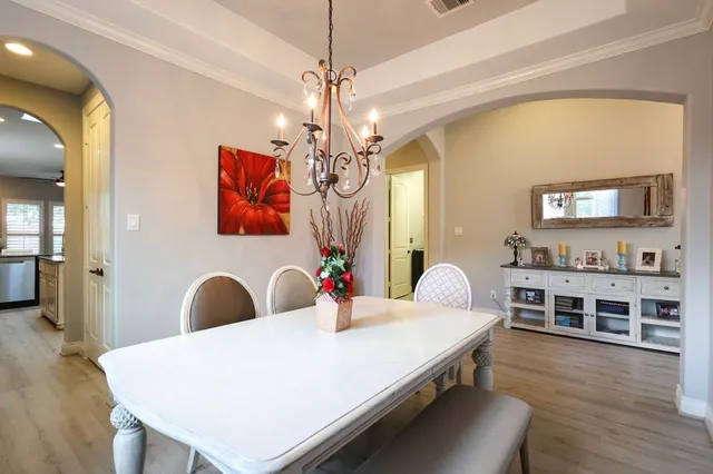a very nice looking dining room with a table and chairs
