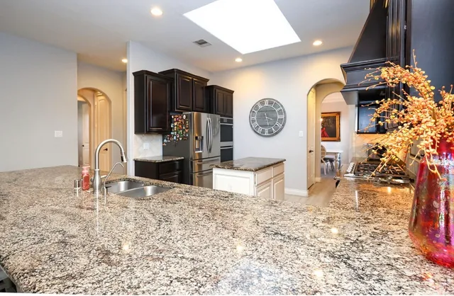 a kitchen that has a lot of cabinets