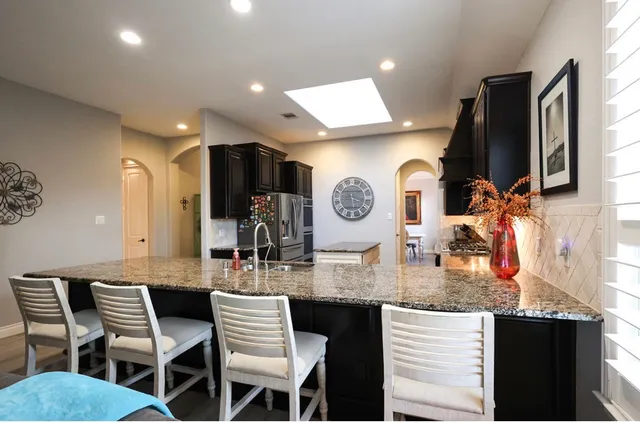a kitchen with a dining table and chairs