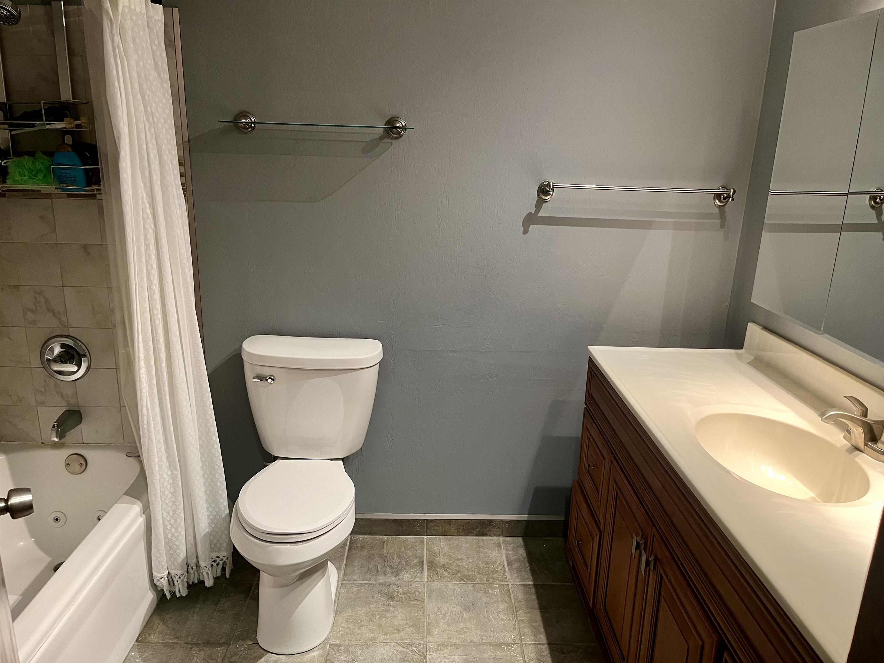 4575 Sunderman Road Rockford, IL 61114 - Photo 5 of 16 a bathroom with a sink a toilet and shower