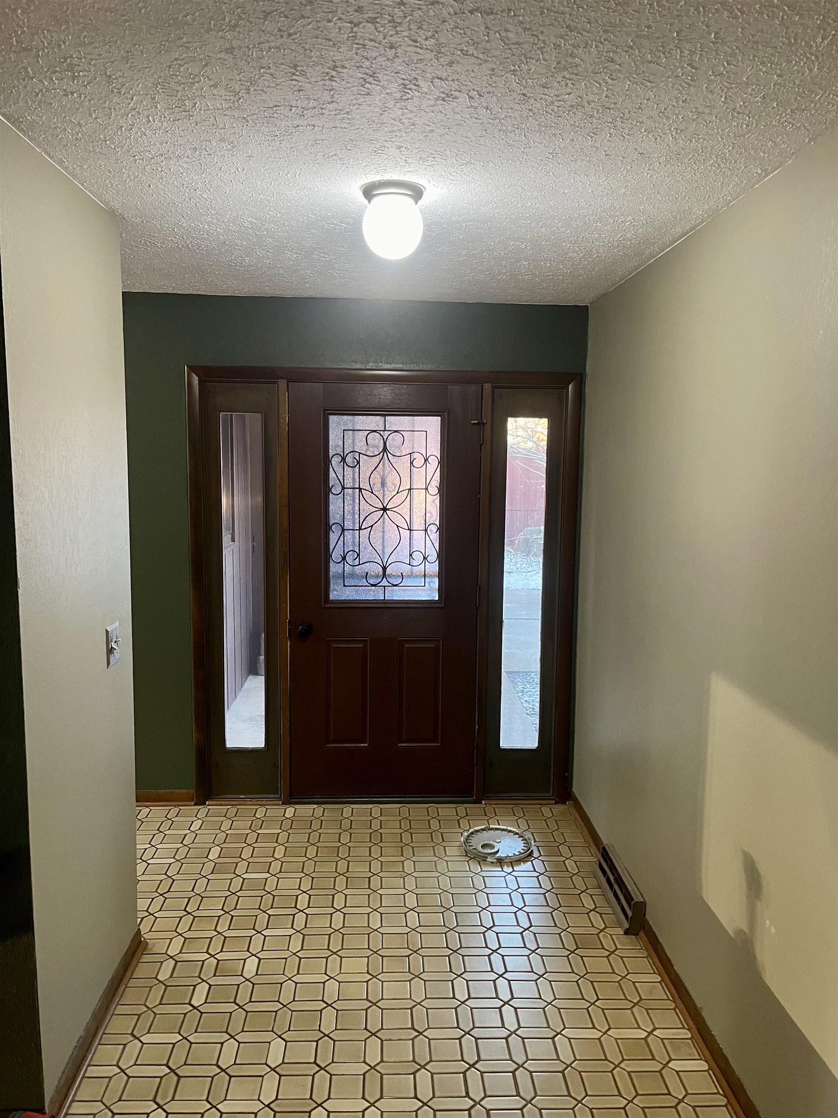 4575 Sunderman Road Rockford, IL 61114 - Photo 6 of 16 an empty room with window and hallway