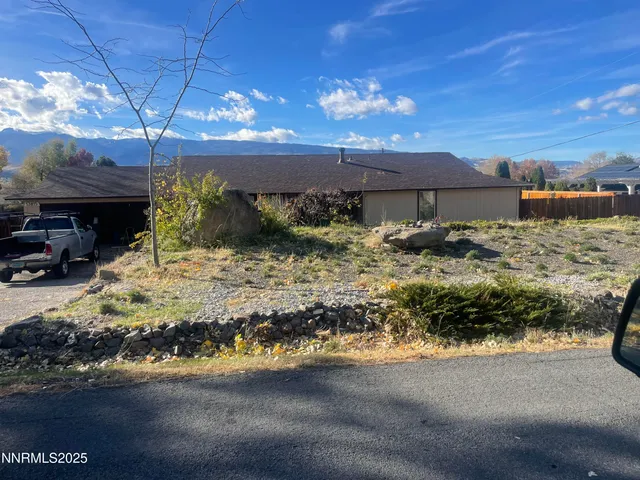 a view of a backyard of the house