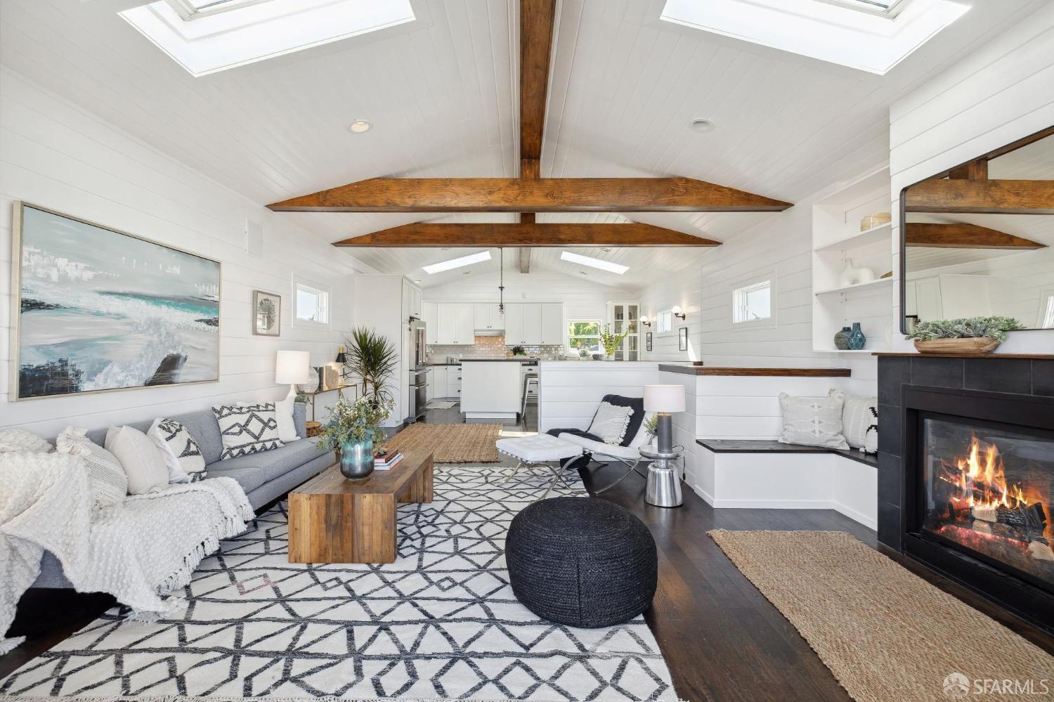 312 Kent Road Pacifica, CA 94044 - Photo 12 of 70 a living room with furniture a large window and a fireplace