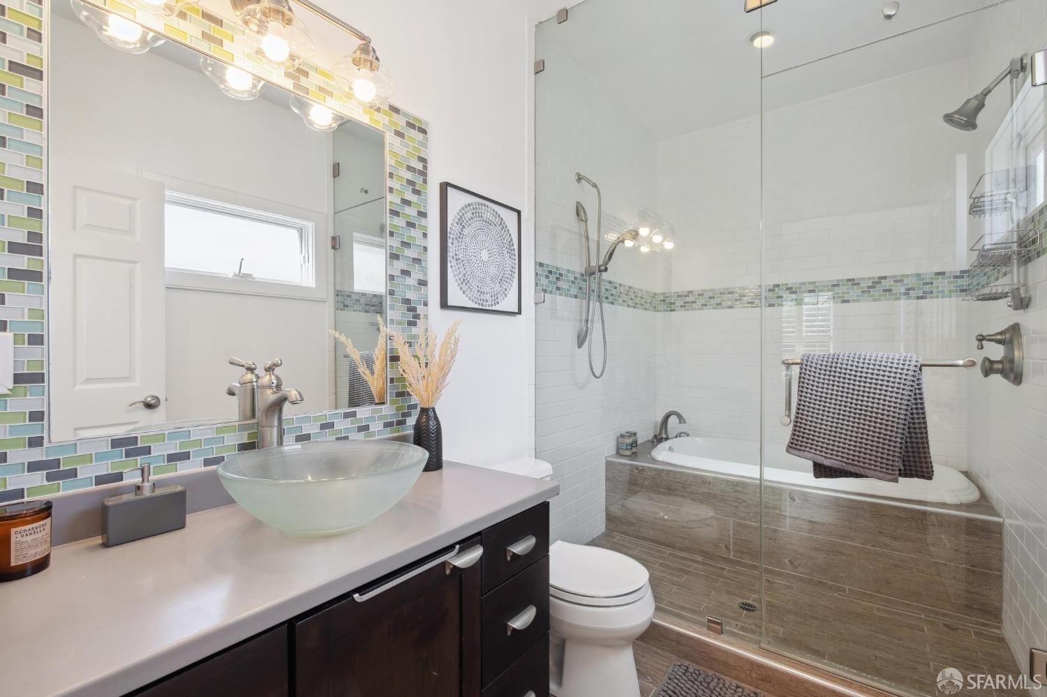 312 Kent Road Pacifica, CA 94044 - Photo 28 of 70 a bathroom with a sink a toilet and a mirror
