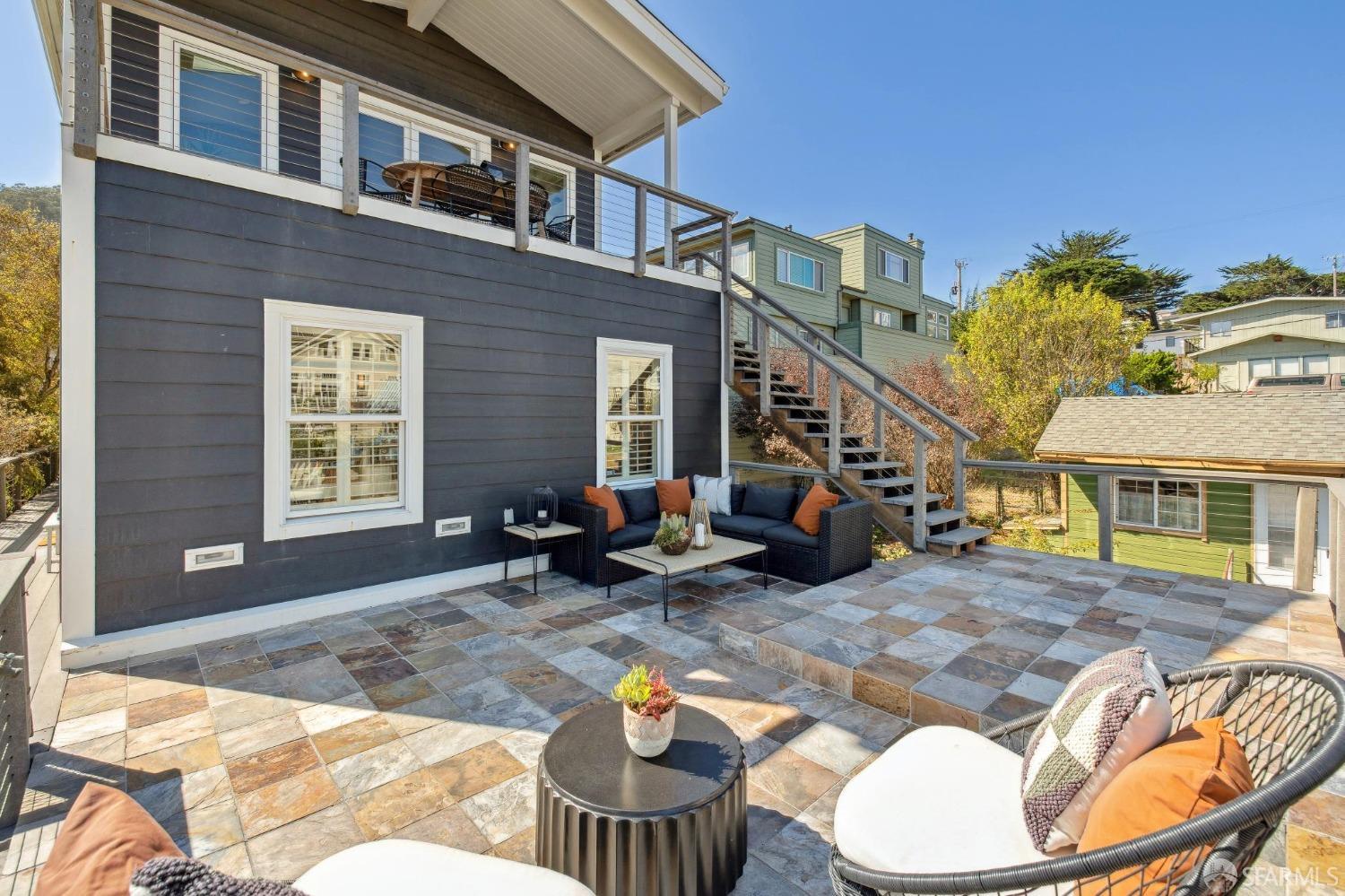 312 Kent Road Pacifica, CA 94044 - Photo 43 of 70 a view of a patio with couches table and chairs and potted plants