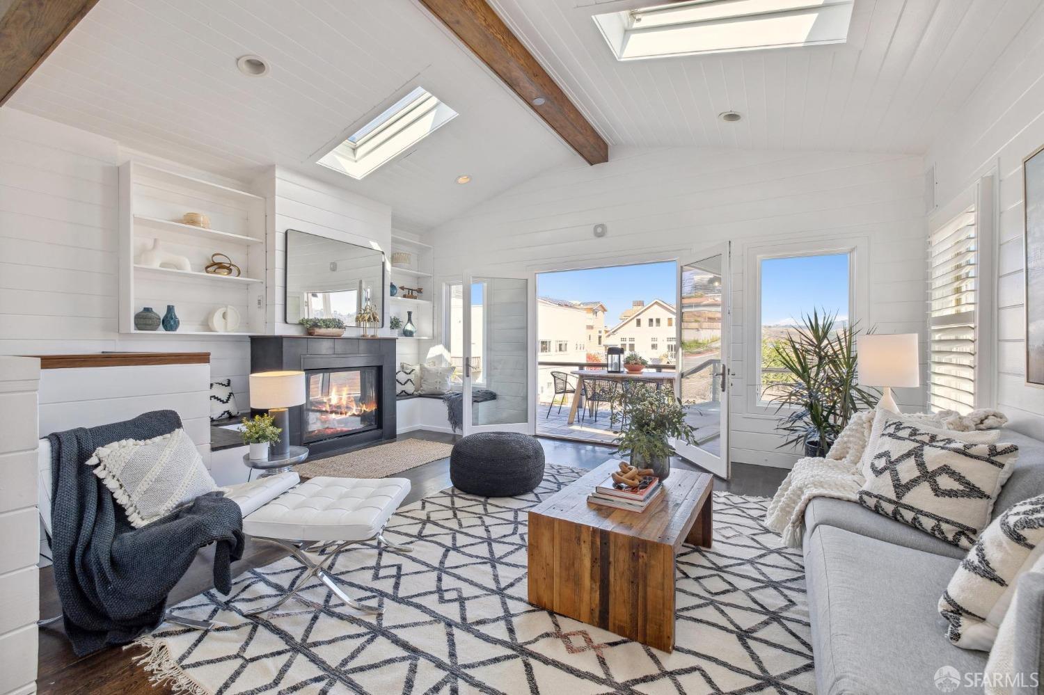 312 Kent Road Pacifica, CA 94044 - Photo 5 of 70 a living room with fireplace furniture and a large window