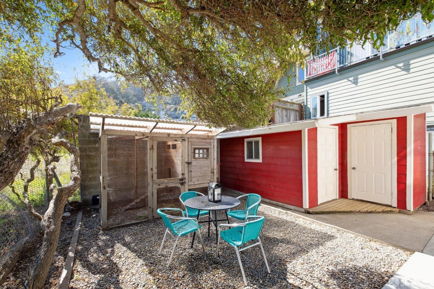 312 Kent Road Pacifica, CA 94044 - Photo 51 of 70 a backyard of a house with table and chairs