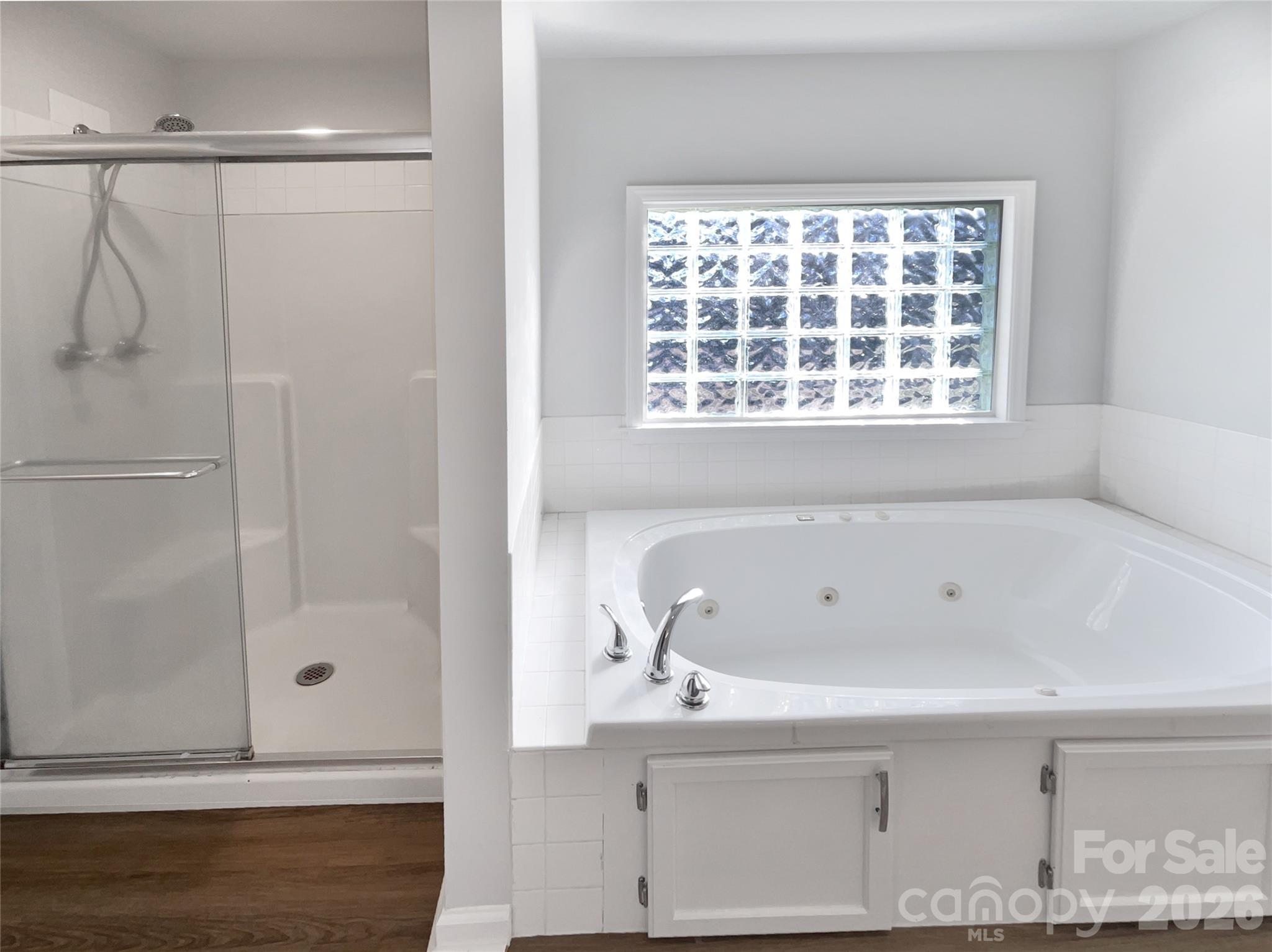 4748 Hickory Grove Road Mount Holly, NC 28120 - Photo 14 of 17 a bathroom with a bathtub and shower