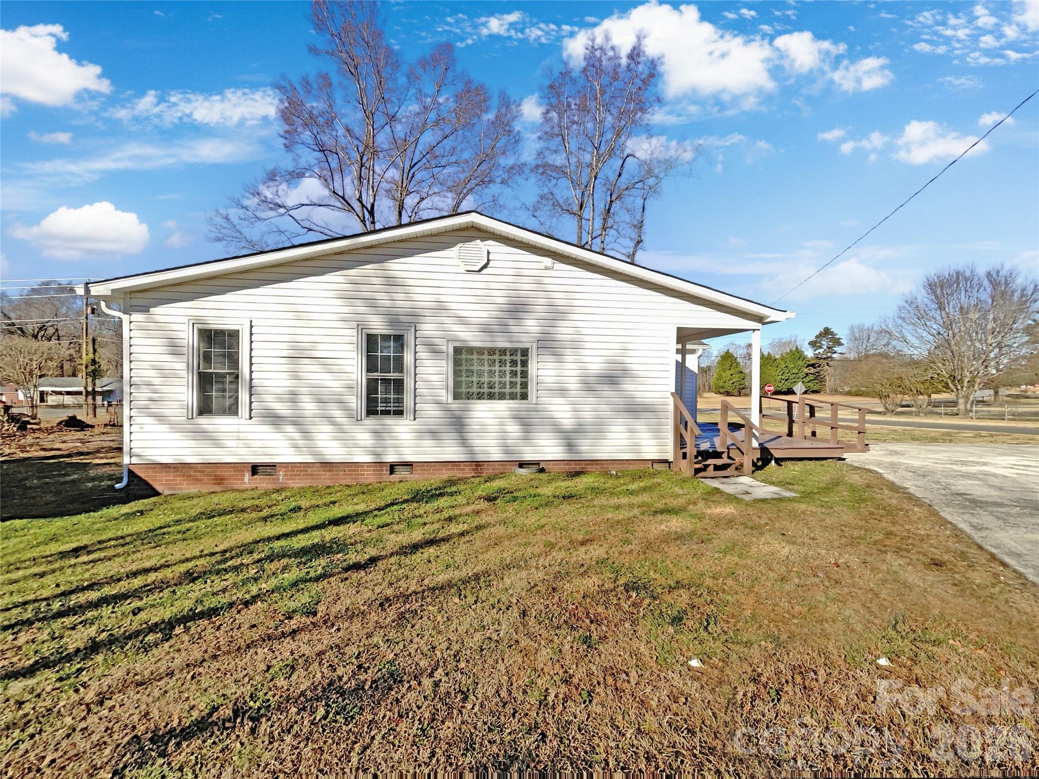 4748 Hickory Grove Road Mount Holly, NC 28120 - Photo 17 of 17 a view of a house with a backyard