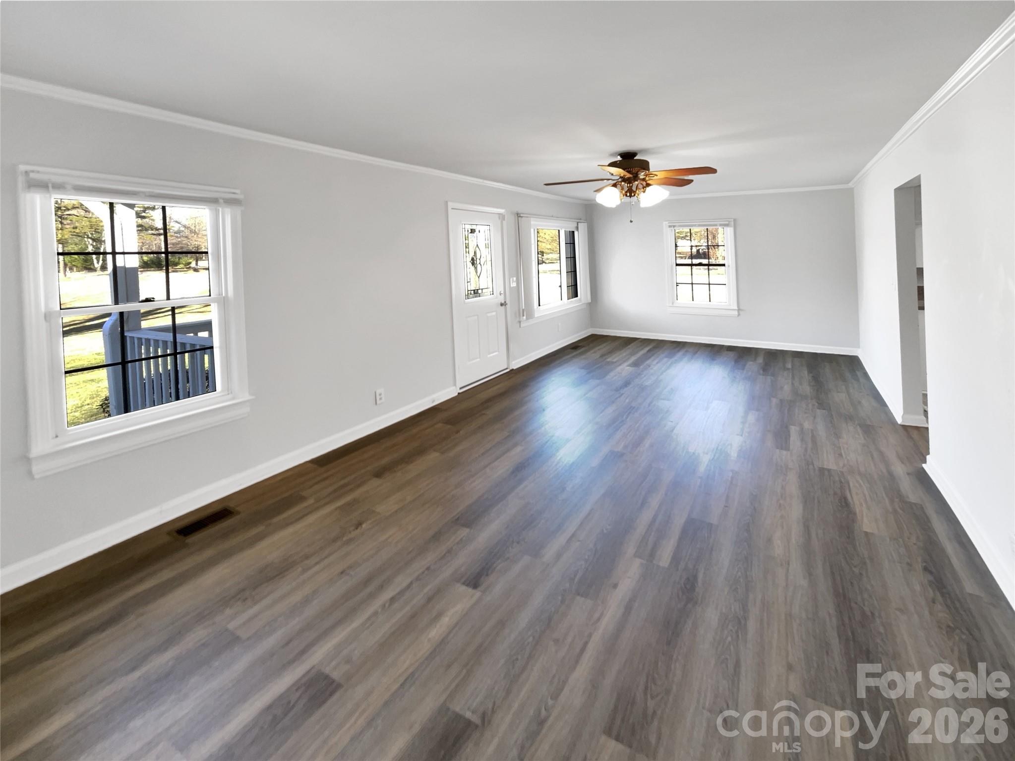 4748 Hickory Grove Road Mount Holly, NC 28120 - Photo 4 of 17 a view of an empty room with wooden floor and a window