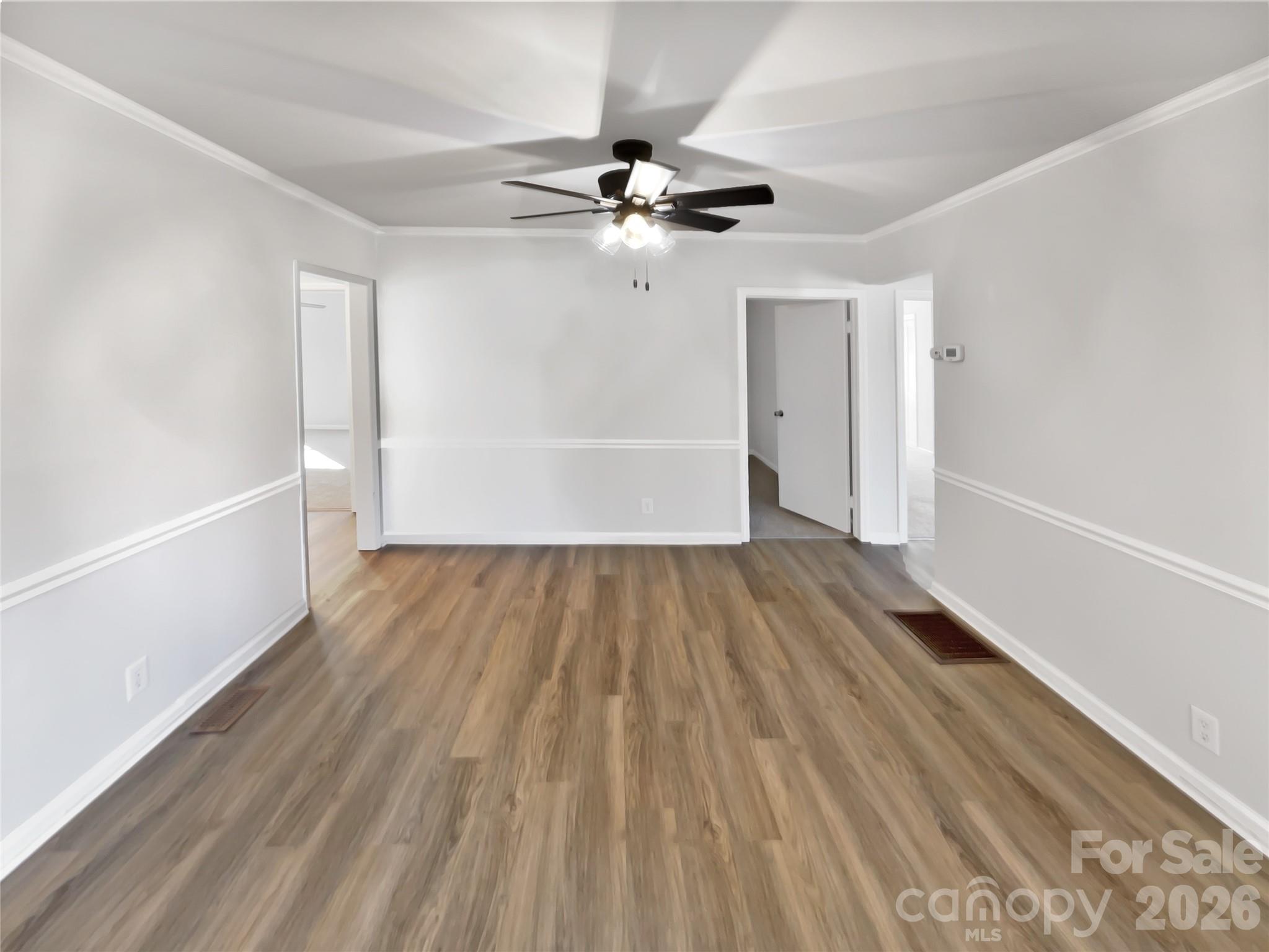 4748 Hickory Grove Road Mount Holly, NC 28120 - Photo 7 of 17 wooden floor in an empty room with a window