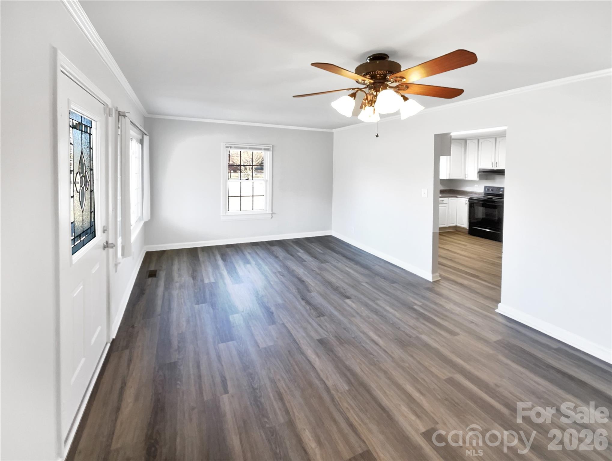 4748 Hickory Grove Road Mount Holly, NC 28120 - Photo 8 of 17 wooden floor in an empty room with a window