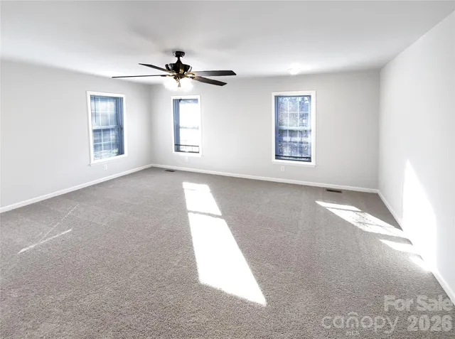 a view of empty room with windows