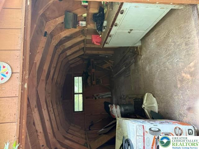 2045 Church Road Bethlehem, PA 18015 - Photo 8 of 42 A utilitarian shed with exposed wood framing offers practical storage space.