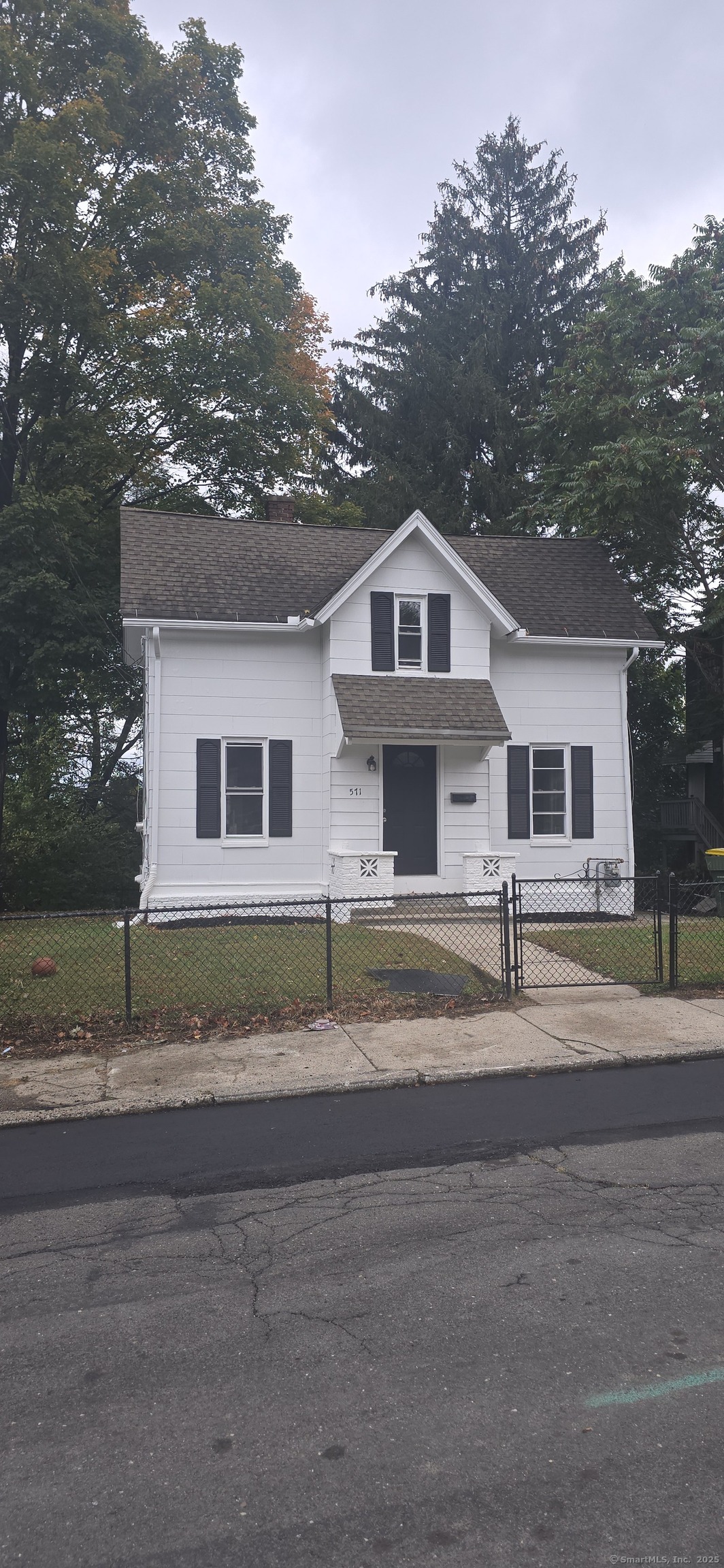 571 Wilson Street Waterbury, CT 06708 - Photo 1 of 23 a front view of a house with a yard