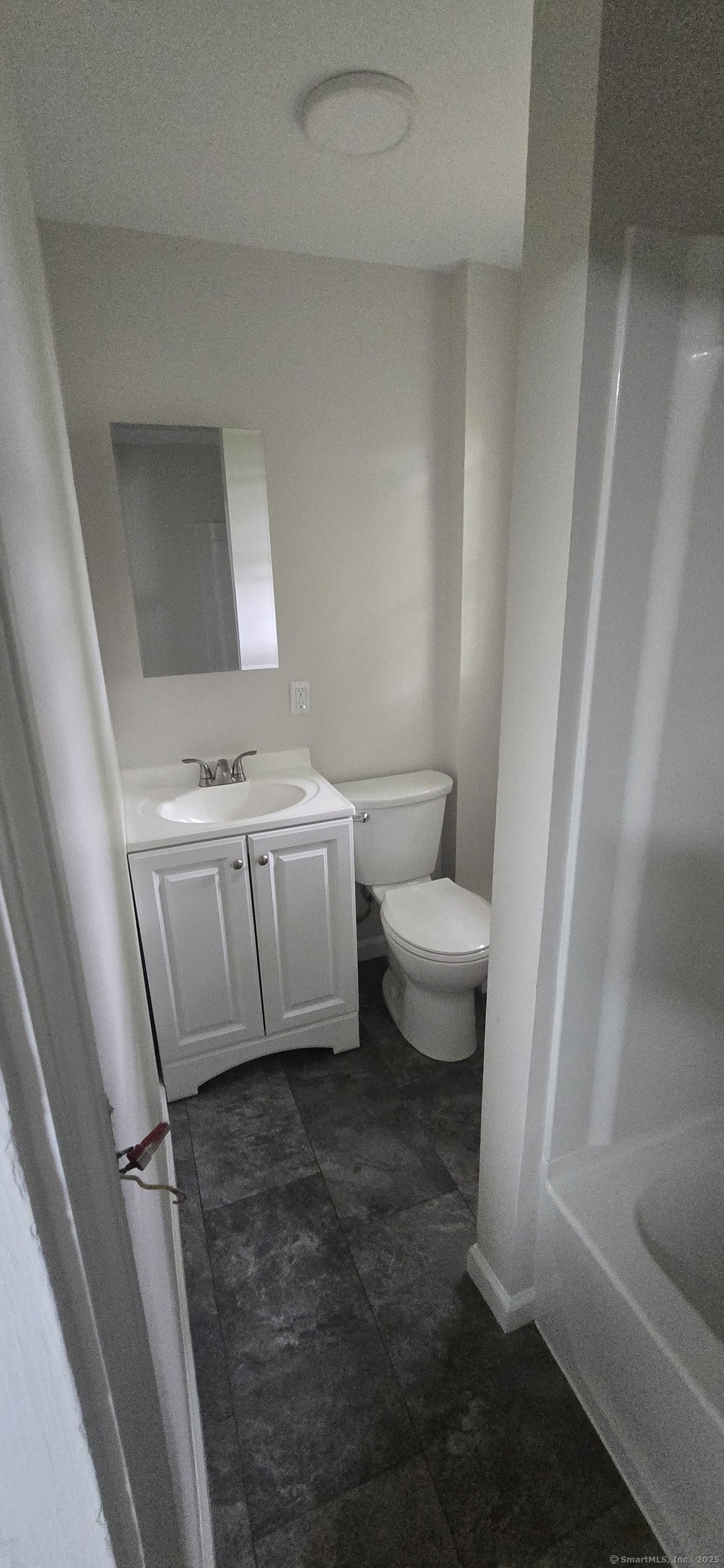 571 Wilson Street Waterbury, CT 06708 - Photo 12 of 23 a bathroom with a toilet and a sink