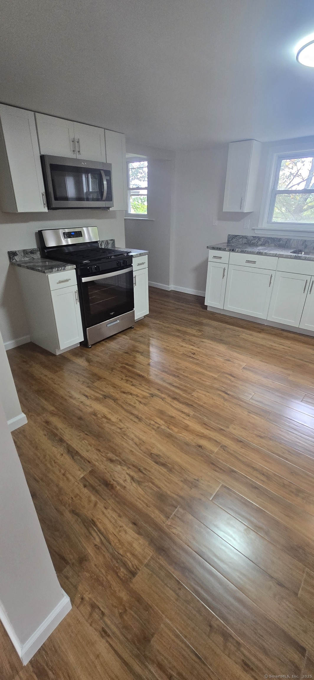 571 Wilson Street Waterbury, CT 06708 - Photo 5 of 23 a view of kitchen and microwave