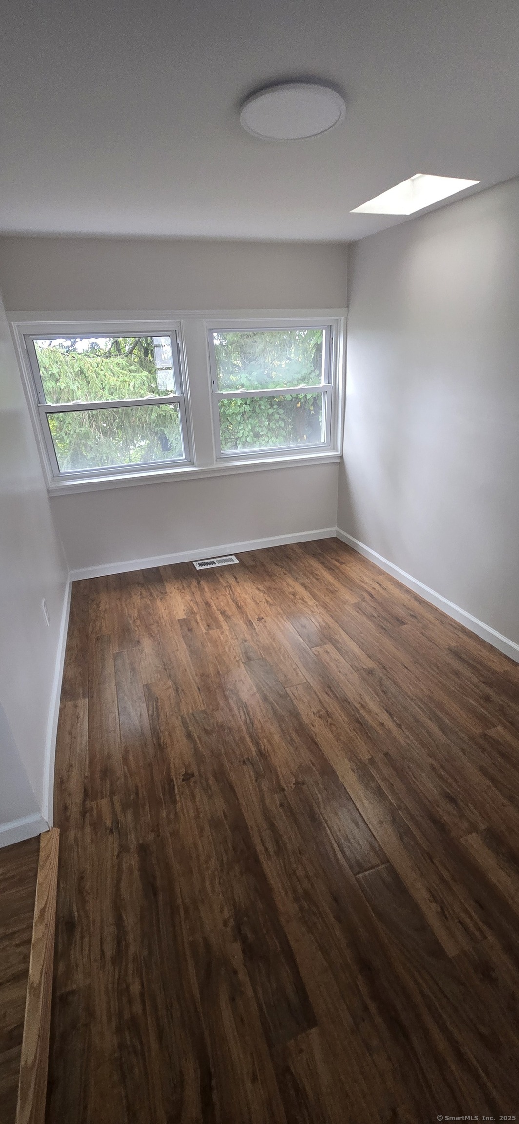 571 Wilson Street Waterbury, CT 06708 - Photo 7 of 23 wooden floor in an empty room