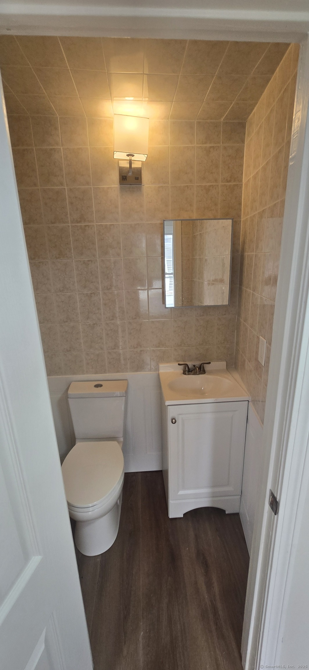 571 Wilson Street Waterbury, CT 06708 - Photo 9 of 23 a bathroom with a granite countertop toilet and a sink