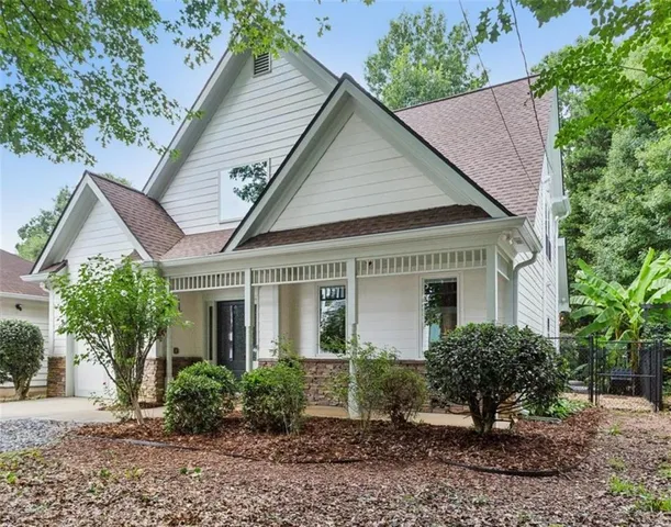 a view of a house with a yard and plants
