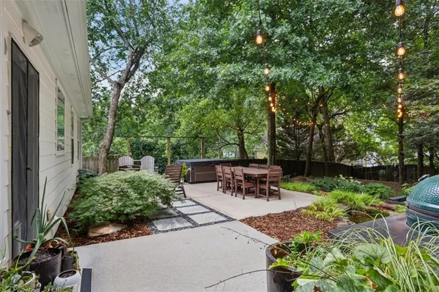 a front view of a house with garden and porch